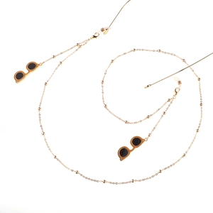 Minimalist gold beaded eyeglass chain with stylish black sunglass pendants and silicone loops
