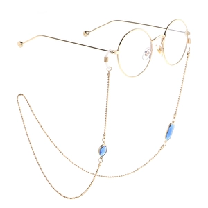 Monture de lunettes ronde dorée avec chaîne perlée assortie et breloques en cristal bleu