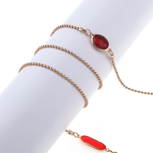 Détails de la chaîne de lunettes en perles dorées avec pierres ovales en cristal rouge