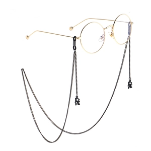 Fashionable gold round frame glasses with a black metal LOVE pendant neck chain strap