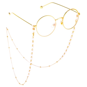 Lunettes rondes dorées classiques avec une chaîne élégante en perles blanches et métal