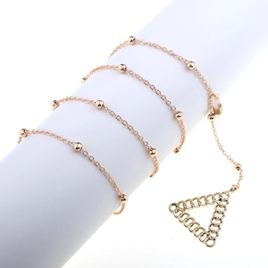 Elegant rose gold eyeglass chain with metallic beads and triangular pendant detail