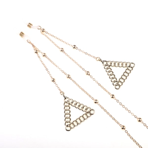 Golden metal eyewear chain with star-beads and interlocking triangle pendants on white background