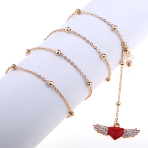 Golden eyewear chain featuring heart with wings charm on minimalist beaded necklace