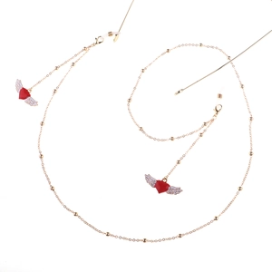 Golden eyewear chain with winged red heart pendants and clear silicone loops
