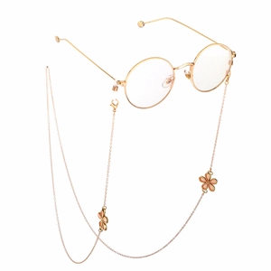 Chaîne à lunettes dorée avec pendentifs fleurs roses sur monture ronde minimaliste