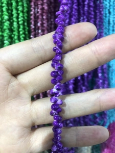 Macro shot of purple spiral shell beads for DIY eyewear chains and jewelry