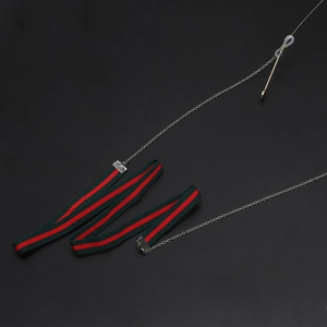 Ethnic eyeglass strap with red and green stripe ribbon and silver chain clasp