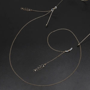 Golden metal eyeglass chain featuring fish bone pendants and non-slip silicone loops