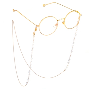 Golden chain eyewear holder with clear crystals and stylish round metal frame glasses