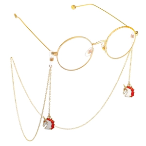 Lunettes rondes dorées avec chaîne antidérapante et pendentif licorne sur fond blanc