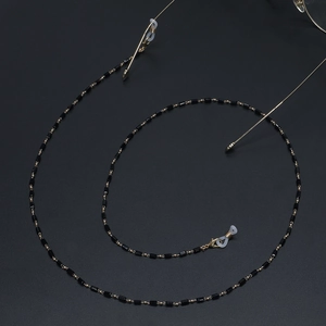 Chaîne de lunettes faite main avec perles de cristal noir et accents en métal doré