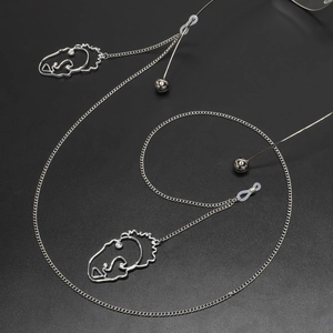 Chaîne à lunettes en métal argenté avec pendentifs visages creux et perles décoratives polies