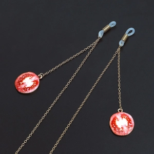 Golden anti-slip metal eyewear chain featuring creative red tomato slice pendant