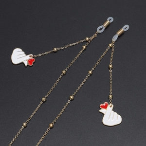 Golden alloy eyewear chain with beaded details and cute heart hand gesture pendant