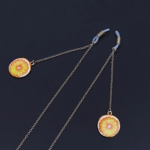 Golden metal glasses chain with realistic orange fruit pendants and non-slip rubber ends