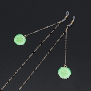 Golden metal glasses chain featuring green cucumber pendants and non-slip silicone loops