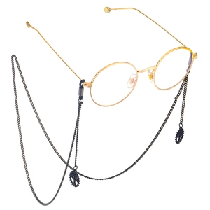 Minimalist black eyewear chain with gold frame glasses and tree of life charm