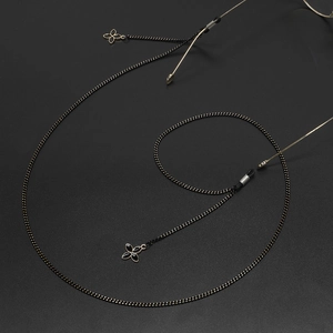 Modische schwarz-goldene Brillenkette mit elegantem Blumenanhänger und Rutschschutz
