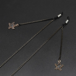 Fashionable black eyewear chain with gold star pendants and adjustable anti-slip loops