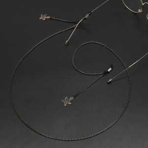 Fashionable black metal eyewear chain with sparkling starfish pendants and rubber loops