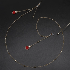 Chaîne de lunettes dorée élégante avec perles et pendentifs en agate rouge