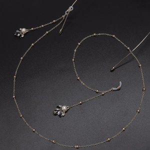 Elegant gold metal glasses chain featuring floral rhinestones and white pearls design