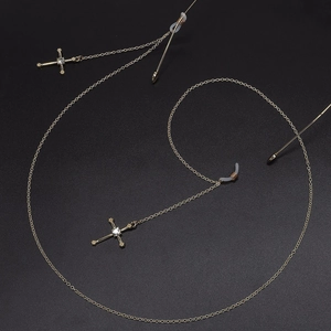 Golden eyewear chain featuring sparkling rhinestone cross pendants and anti-slip rubber ends