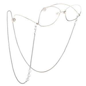 Silver eyewear chain with white pearls and silicone loops shown with glasses