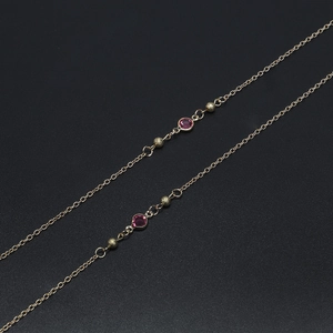 70cm gold glasses chain featuring elegant magenta glass beads and frosted metal accents
