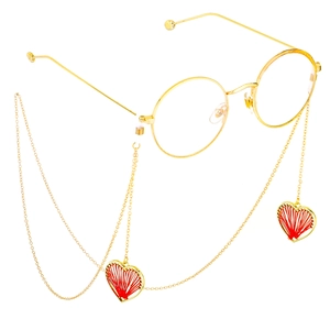 Golden round frame glasses with anti-slip chain and red woven heart pendants