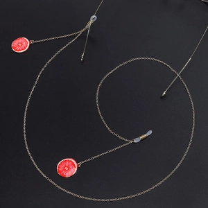 Golden eyewear chain featuring grapefruit charms and non-slip silicone connectors