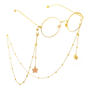 Lunettes rondes dorées avec chaîne à perles et breloques en forme de fleurs de cerisier