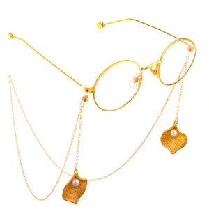 Gold metal round glasses with non-slip chains and geometric pearl leaf pendants