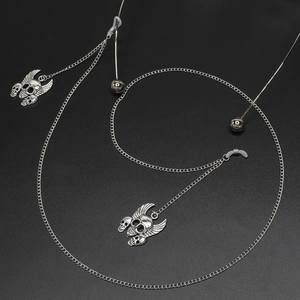 Silver gecko pendant eyewear chain with non-slip silicone loops on black texture