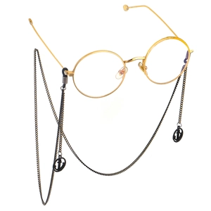 Round gold metal glasses frame with black decorative anchor pendant chain necklace