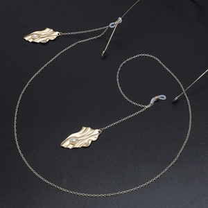 Golden metal eyewear chain with vintage leaf pendants and white pearl accents for glasses