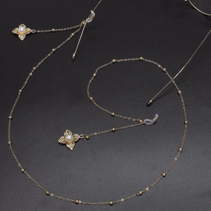 Golden metal eyewear chain with pearl flower pendants and non-slip silicone loops