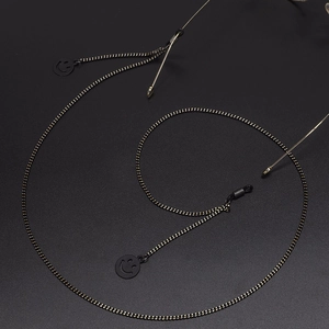 Minimalist black beaded glasses chain featuring a stylish circular smiley face pendant