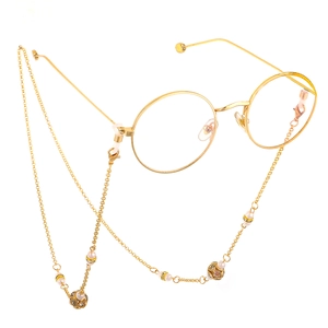 Golden lantern chain with rhinestones and pearls for glasses shown on white background