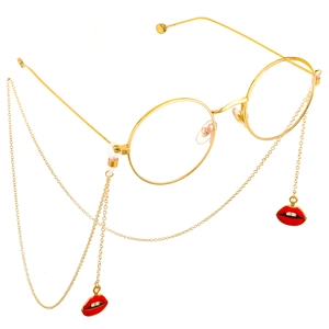 Golden round glasses chain featuring fashionable red lips enamel pendants on white background