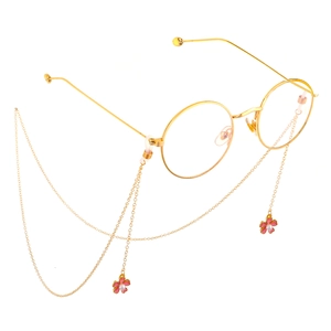 Lunettes rondes dorées avec chaîne décorative et pendentifs fleurs de perles roses
