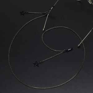 Fashionable gold eyewear chain with black hollow star pendants and silicone hooks