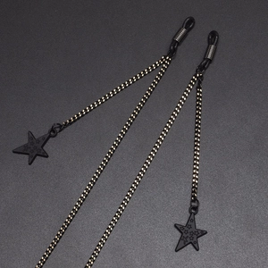 Minimalist black metal eyewear chain with star charms and adjustable rubber loops