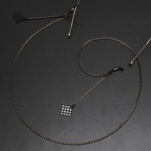 Fashionable black eyewear chain with checkerboard square pendant on metal link strap