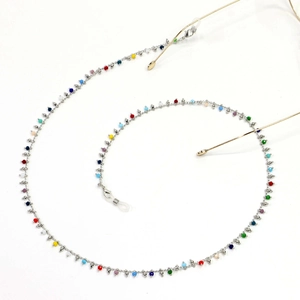 Detail of colorful beads on silver glasses chain with non-slip silicone loops and metal rings