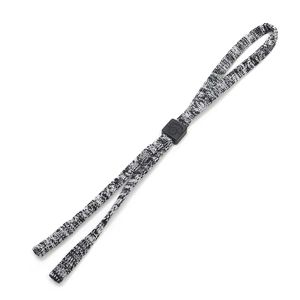 Close-up of black and white woven eyewear cord with adjustable plastic slider
