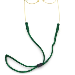 Adjustable woven eyewear strap in green and black on yellow gold metal frame glasses