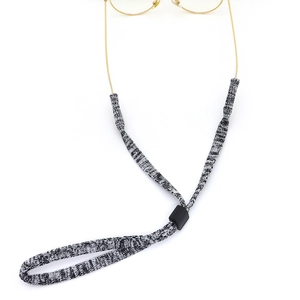 Adjustable black and white woven eyewear strap with non-slip slider for glasses