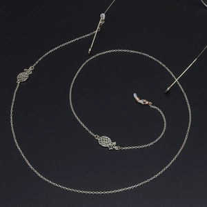 Golden anti-slip eyewear chain featuring detailed pineapple charms and silicone loops